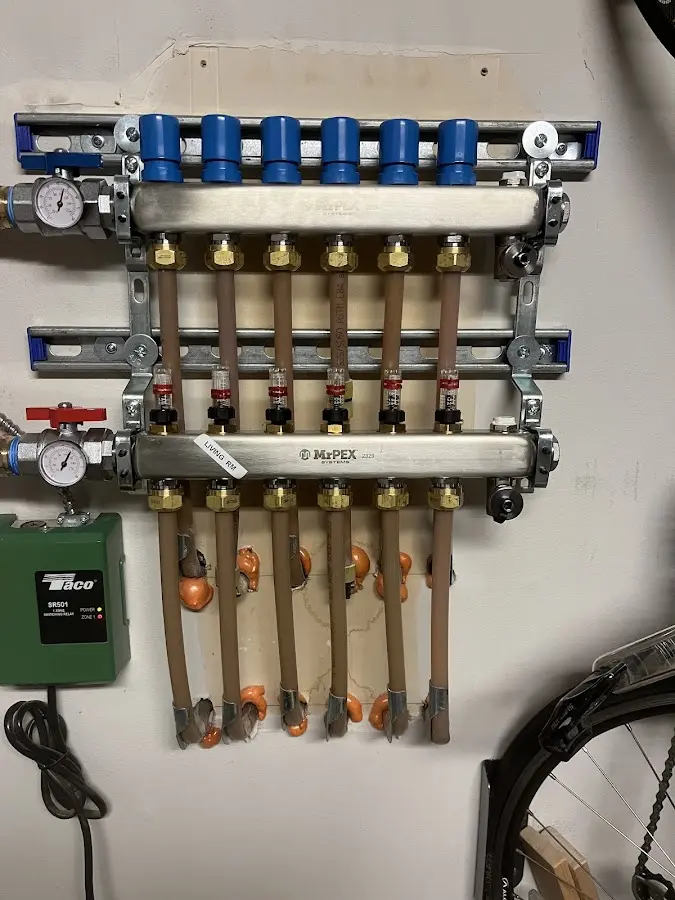 Plumber performing Water Heater Repair at a residential property in Monticello